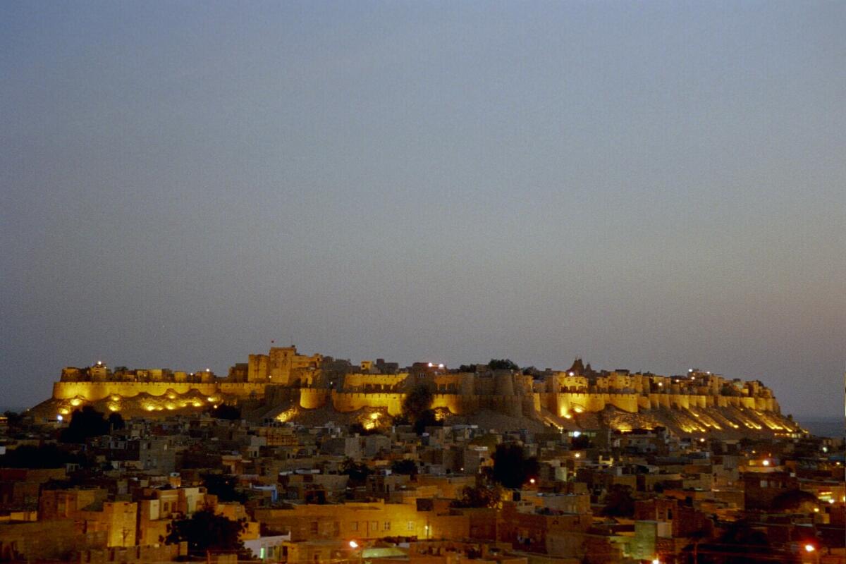 Jaisalmer Fort glowing gold at dusk above the old town