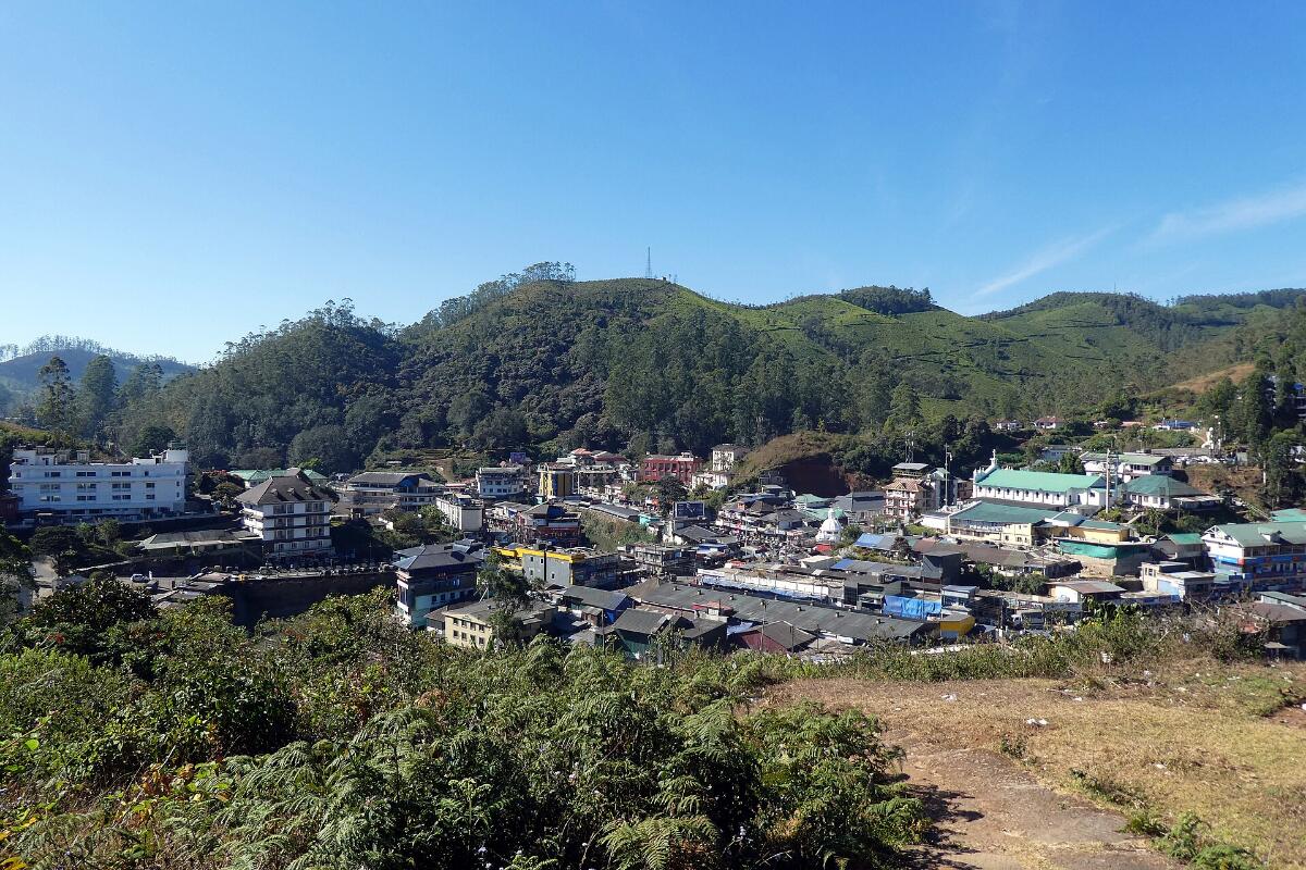 Rolling hills and the town of Munnar seen from above