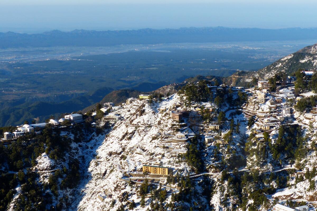 Snow on the ridges of Mussoorie above the Doon valley